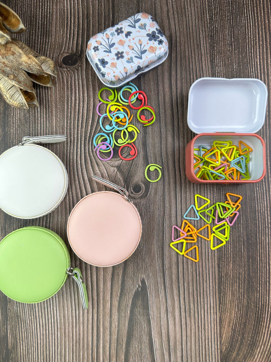 Knitting and crochet stitch markers . 30 assorted stitch markers in a collectible tin box