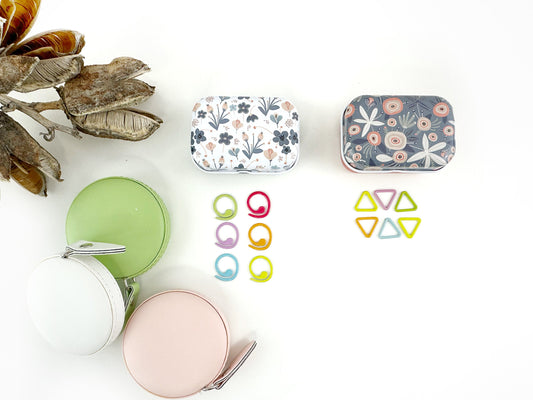 Knitting and crochet stitch markers . 30 assorted stitch markers in a collectible tin box