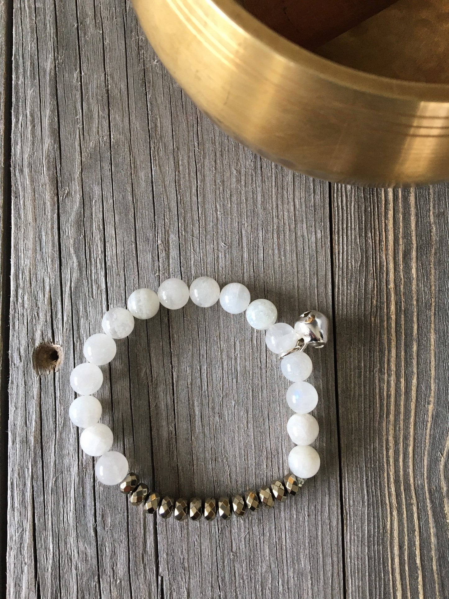 Moonstone Natural Stone bracelet with pyrite beads and a silver bell