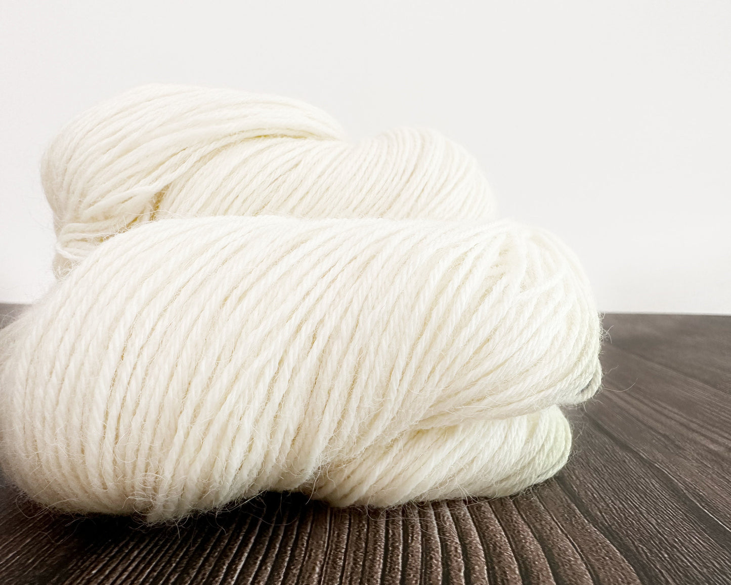 Baby Llama . undyed . Fingering . ecru and natural light grey