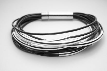 Multi Strand Black Leather Bracelet . Sterling Silver Tubes . Stainless Steel Closure