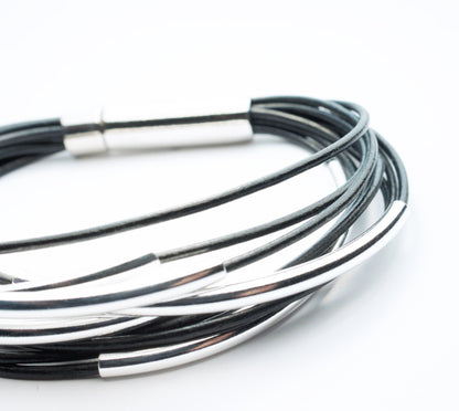 Multi Strand Black Leather Bracelet . Sterling Silver Tubes . Stainless Steel Closure