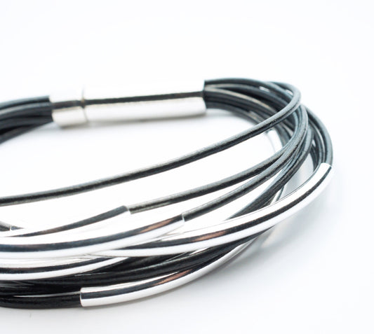 Multi Strand Black Leather Bracelet . Sterling Silver Tubes . Stainless Steel Closure