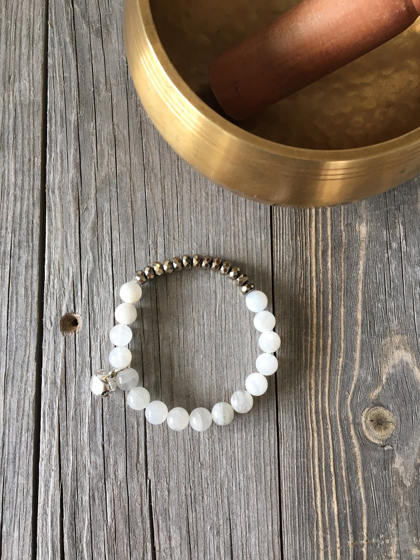 Moonstone Natural Stone bracelet with pyrite beads and a silver bell