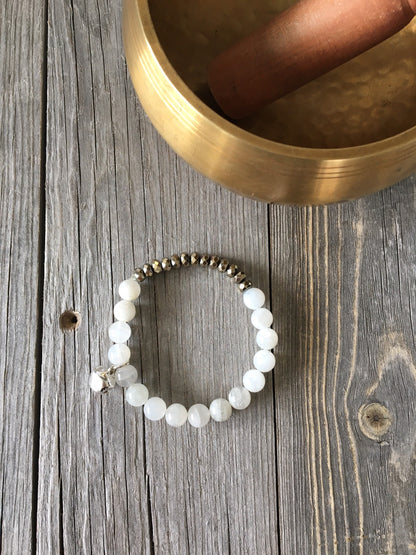 Moonstone Natural Stone bracelet with pyrite beads and a silver bell