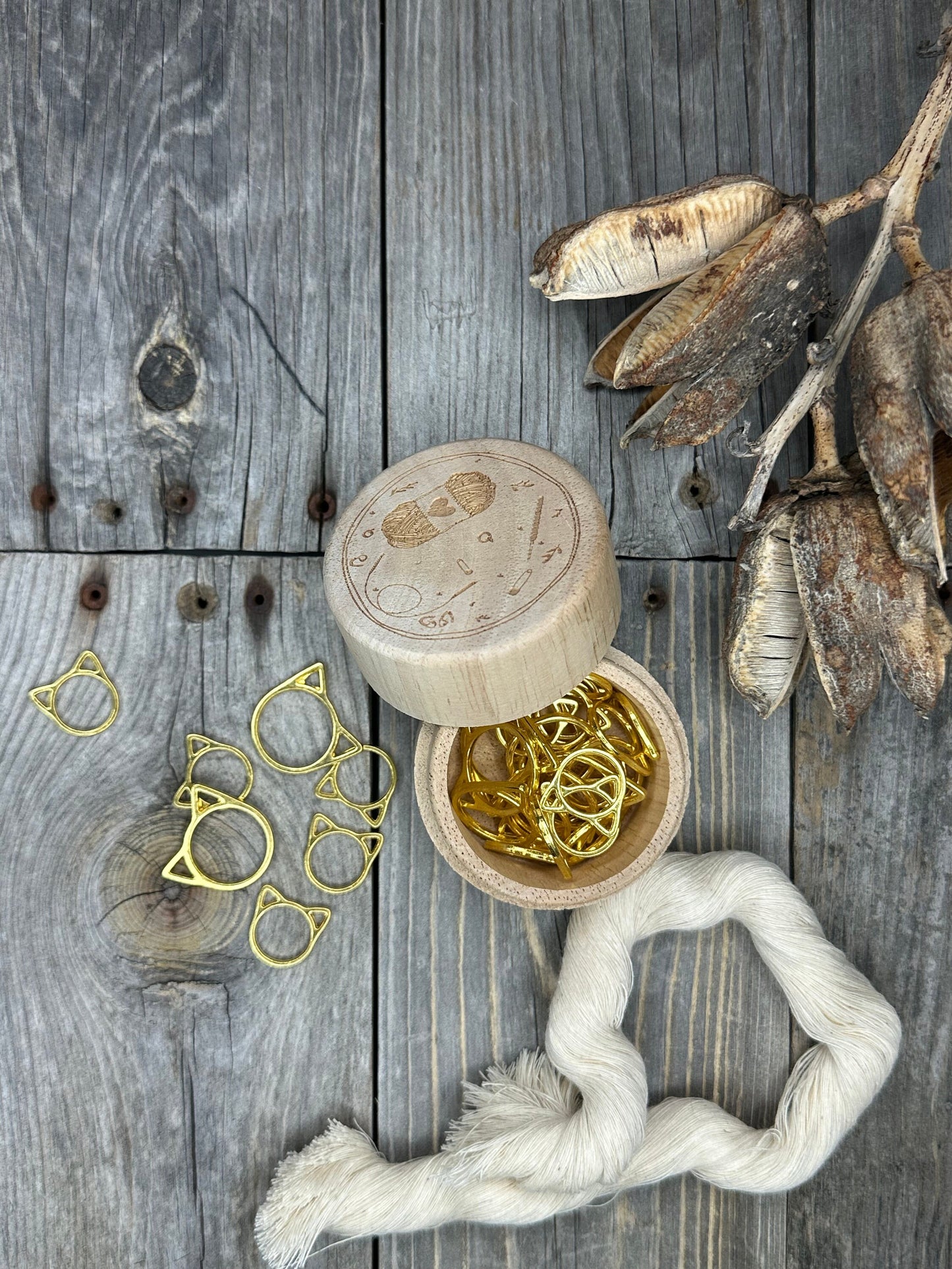 Knitting stitch markers . 30 gold colored cat stitch markers in a wood box
